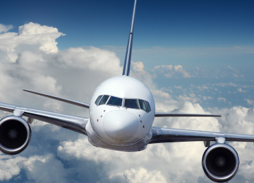 Airplane flying through the sky.