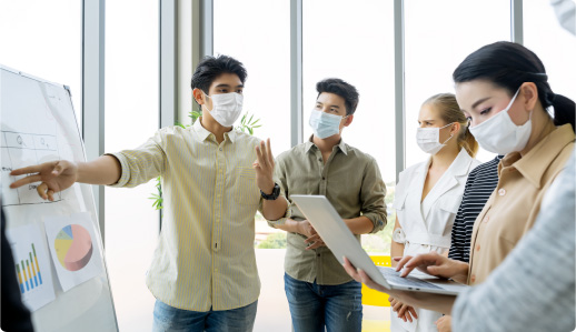 Group of people wearing masks.